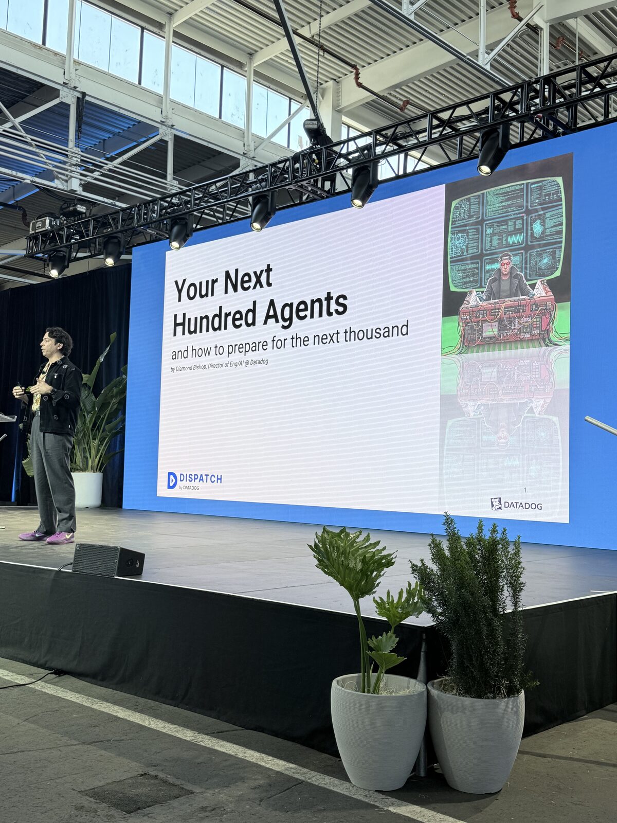 Diamond Bishop on stage with the title slide 'Your Next Hundred Agents — and how to prepare for the next thousand'