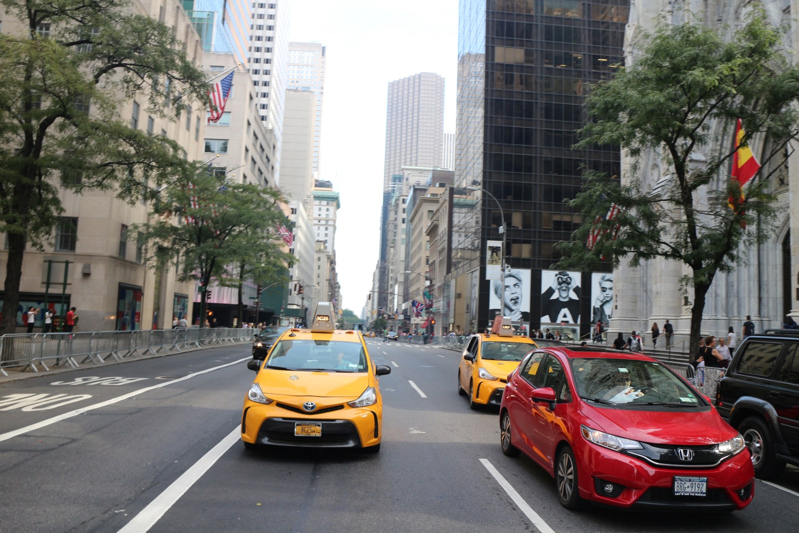 Yellow cabs on a Midtown Manhattan avenue